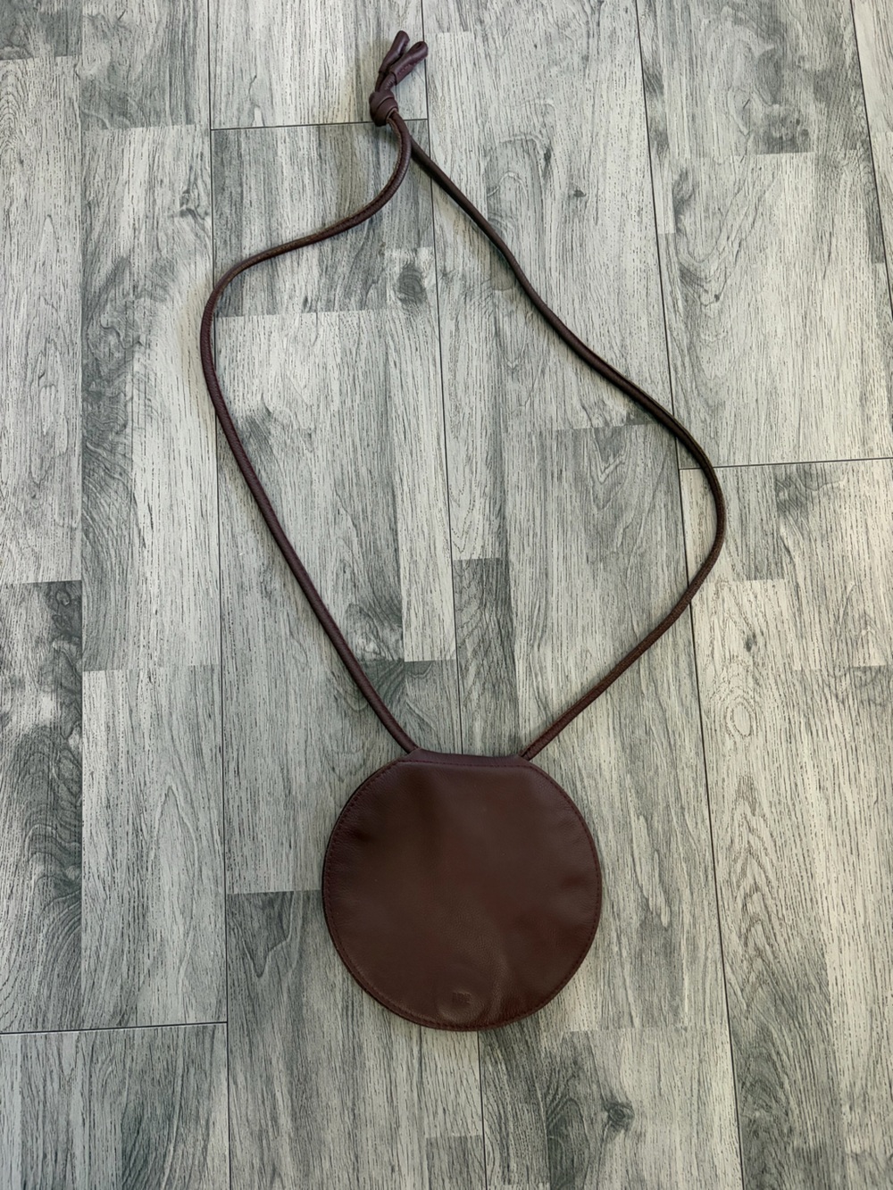 ARE StudioDisc Round Leather Crossbody Bag in Burgundy